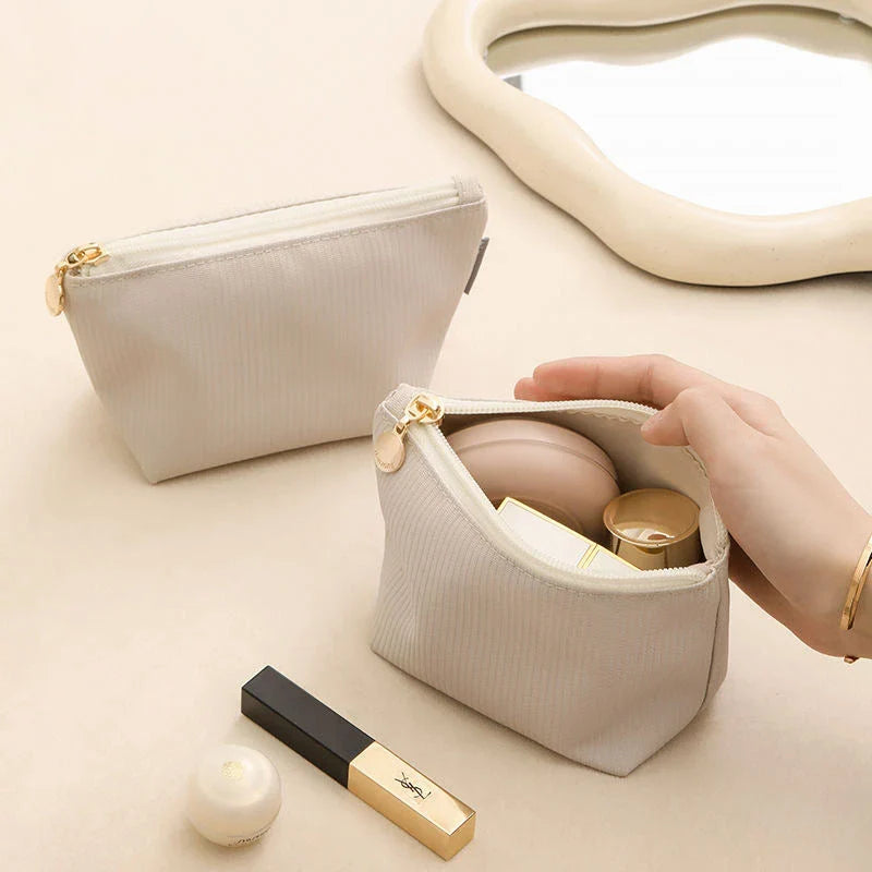 Compact and versatile mini cosmetic pouch in beige and gray colours, perfect for New Zealand travellers