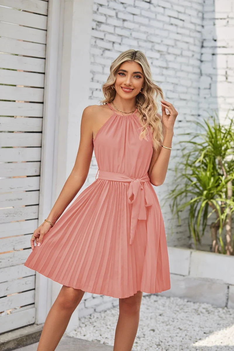 A stylish halter sundress with a pleated skirt, perfect for warm Kiwi summer days