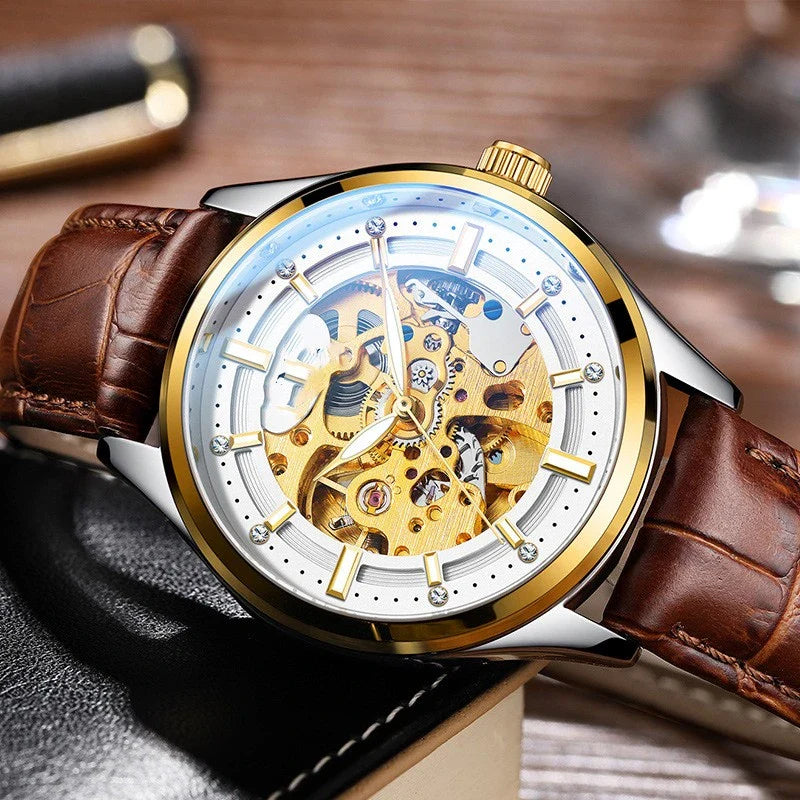 Gold-tone mechanical watch with a white or black leather strap, featuring a sleek and elegant design perfect for the Kiwi lifestyle.