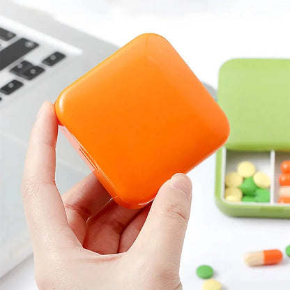 A compact, push-pull pill organiser in a vibrant green colour with cartoon-inspired design