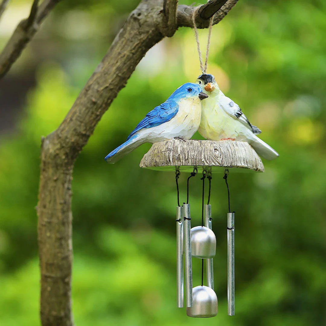 Charming wind chime featuring resin birds in vibrant Kiwi colours, swaying gently in the breeze and emitting a melodious sound.