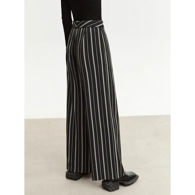 Elegant autumn wide-leg striped trousers for women in a classic black and white pattern