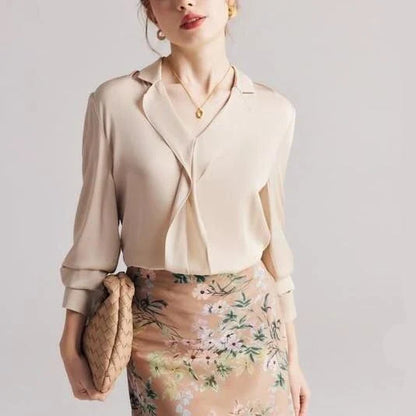 Elegant ruffled silk blouse in champagne color with V-neck design, suitable for professional or casual wear