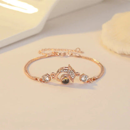 A pair of vibrant projection couple bracelets in rose gold and platinum colors