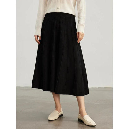 A stylish and versatile mid-calf pleated wool skirt in a chocolate color, perfect for the chilly seasons.