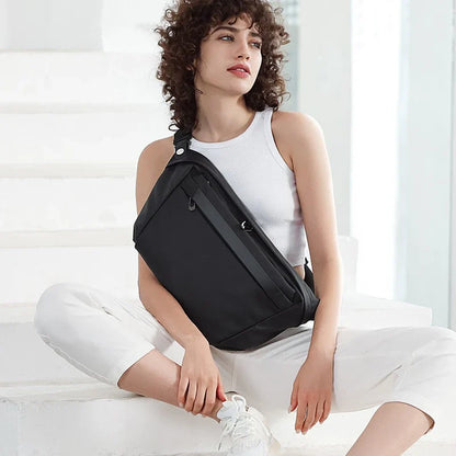 A grey one-shoulder crossbody chest bag with a zippered closure and dedicated pockets for the modern, active Kiwi man