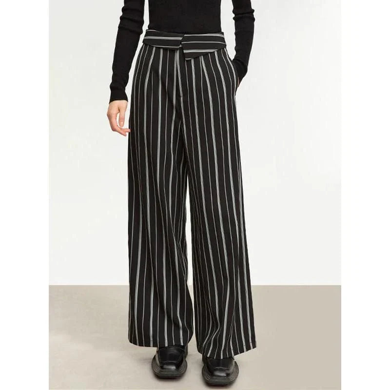 Elegant autumn wide-leg striped trousers for women in a classic black and white pattern