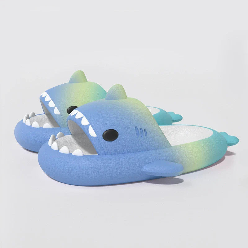 Gradient rainbow shark-patterned slippers with a comfortable EVA sole and durable PVC upper, available in a range of vibrant colours