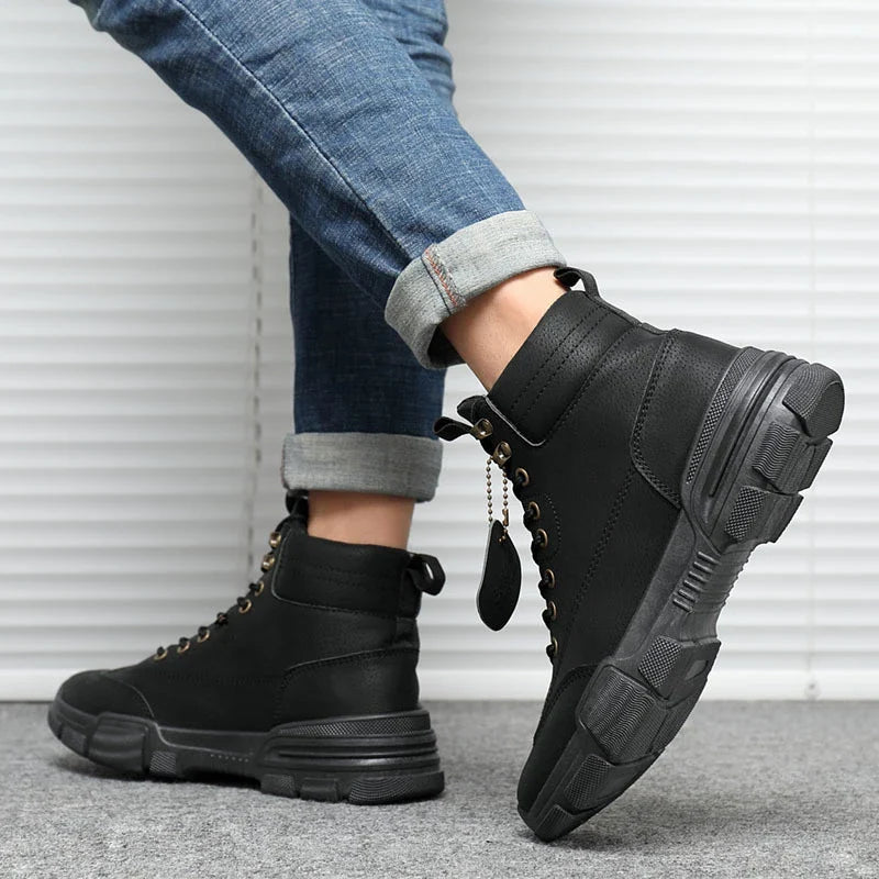 A pair of stylish high-top boots made with premium frosted leather and a durable PVC sole for elevated style and comfort.