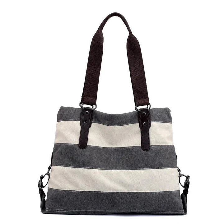 Stylish and practical Kiwi-crafted canvas tote bag with roomy interior, durable polyester lining, and adjustable shoulder straps