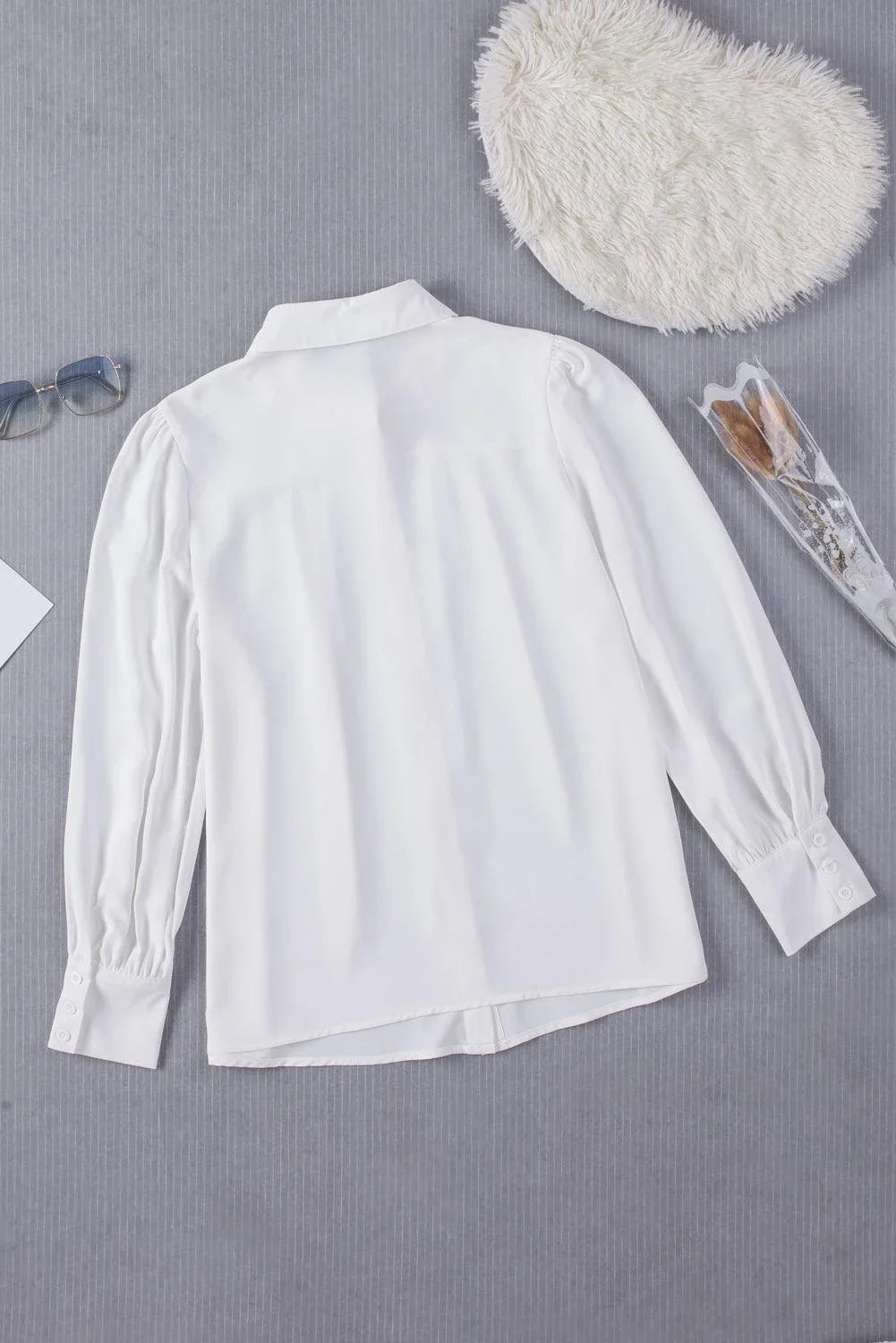 Gathered Detail Puff Sleeve Shirt in blue, featuring a collared neckline, buttoned front, and distinct puff sleeves for a timeless Kiwi style.