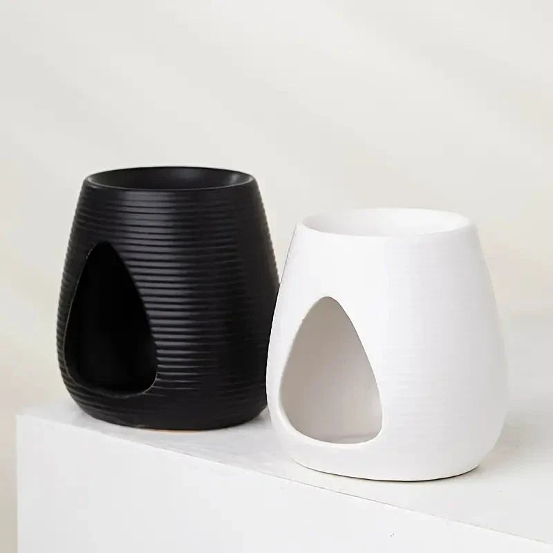 Elegant porcelain aroma diffuser in white and black colours, perfect for creating a relaxing atmosphere in your New Zealand home