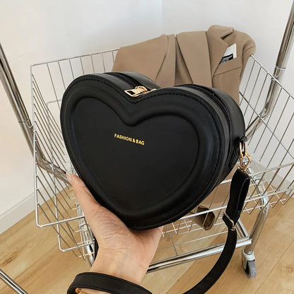 Stylish heart-shaped crossbody bag made from premium PU leather, available in multiple colours for the modern Kiwi woman