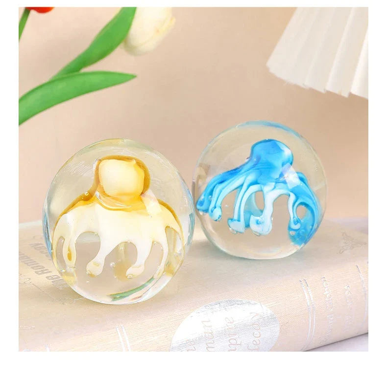 Handcrafted glass octopus windshield washer fluid ornament in ocean blue and tea brown colours, made in New Zealand