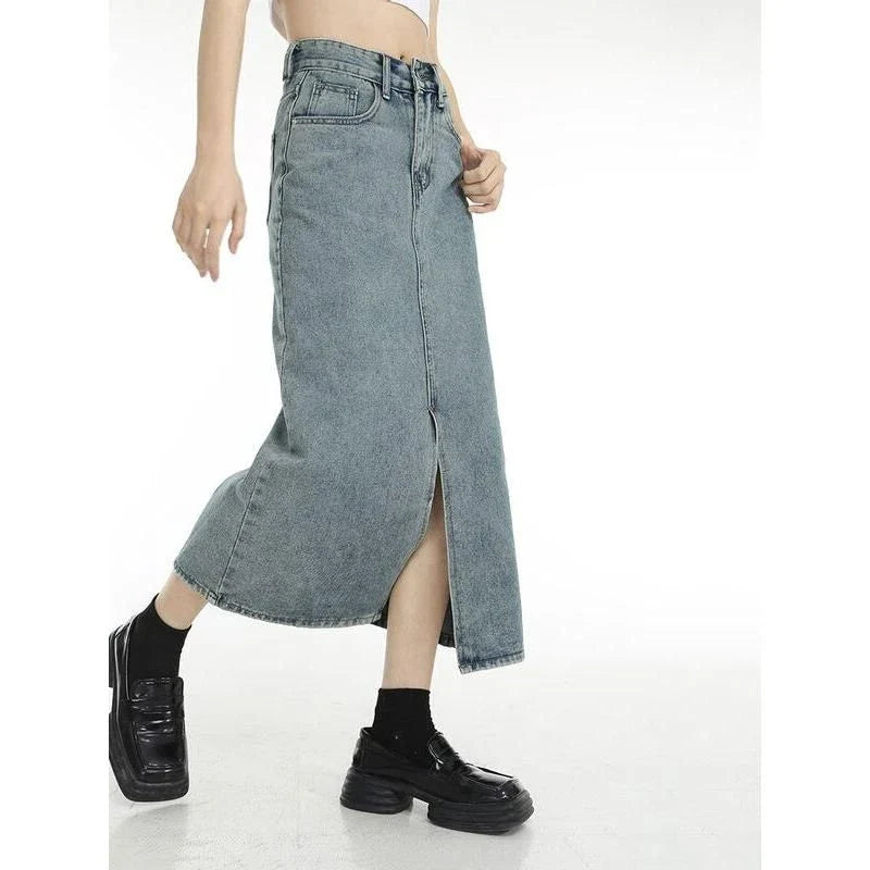 A stylish vintage-inspired denim midi skirt with a front slit, perfect for casual and special occasions.