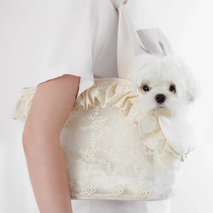 Stylish and comfortable puppy carrier bag made of lightweight nylon with a floral lace design, perfect for carrying small dogs on summer outings.