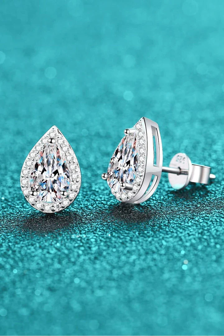 Pair of moissanite teardrop stud earrings made of 925 sterling silver with a polished finish and rhodium plating