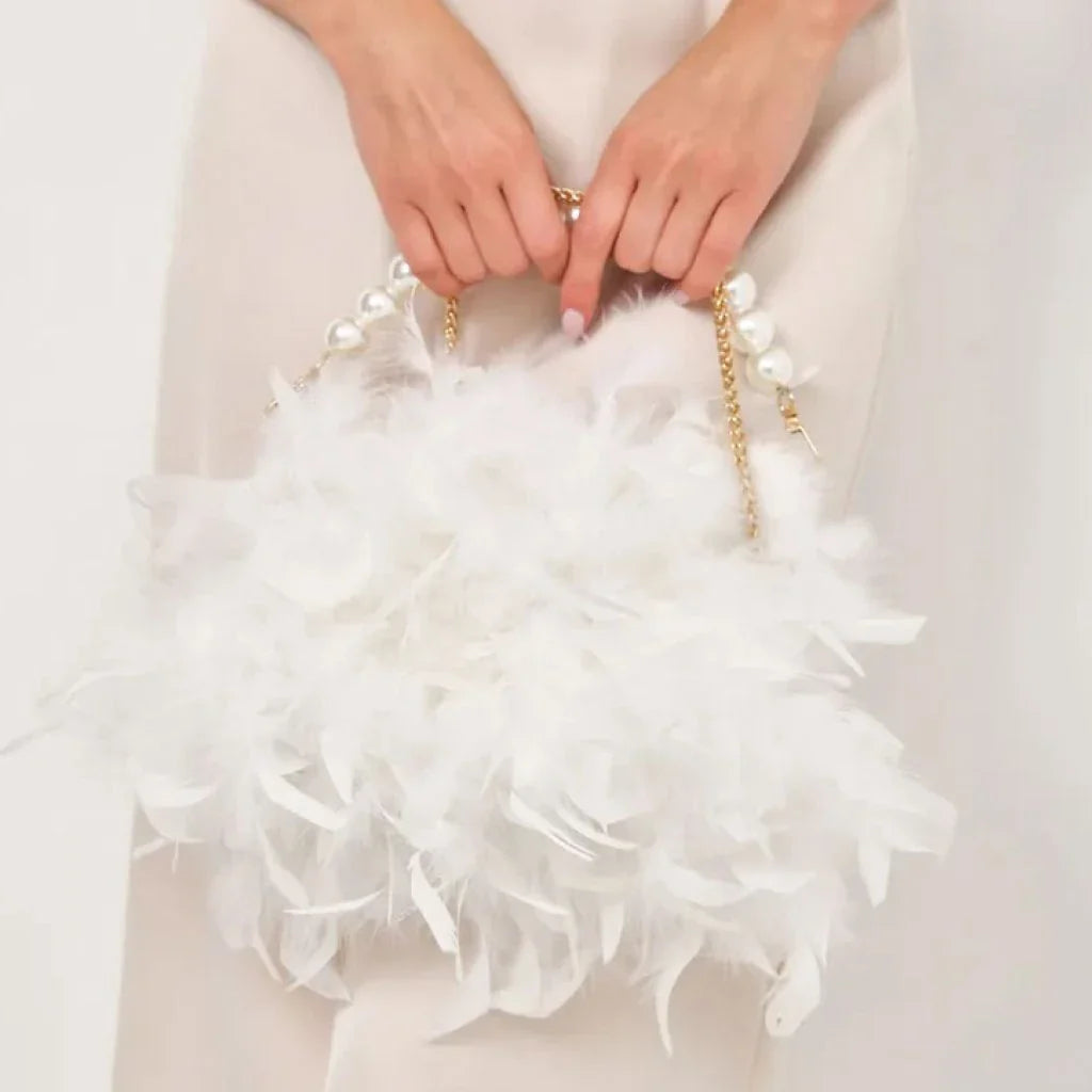 Elegant gray feather and pearl clutch with metal framework, a sophisticated accessory for Kiwi fashionistas