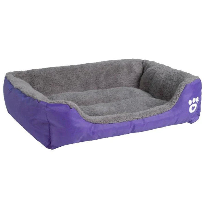 A cozy, waterproof pet bed featuring a soft fleece lining and paw print design, perfect for providing comfort and support for your beloved companion.