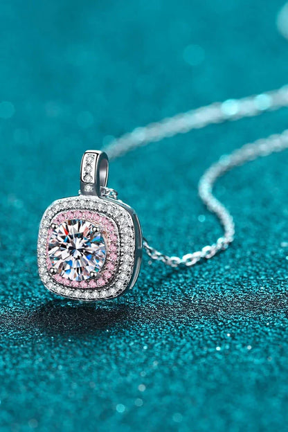 A sterling silver geometric pendant necklace featuring a radiant Moissanite centre stone and accented with shimmering zircon stones