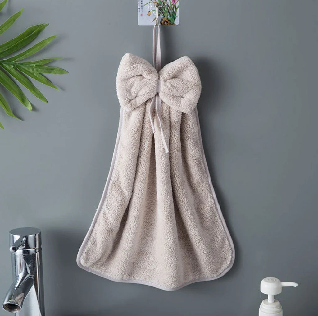 Soft, absorbent coral velvet hand towels with a unique bow design, perfect for Kiwi homes