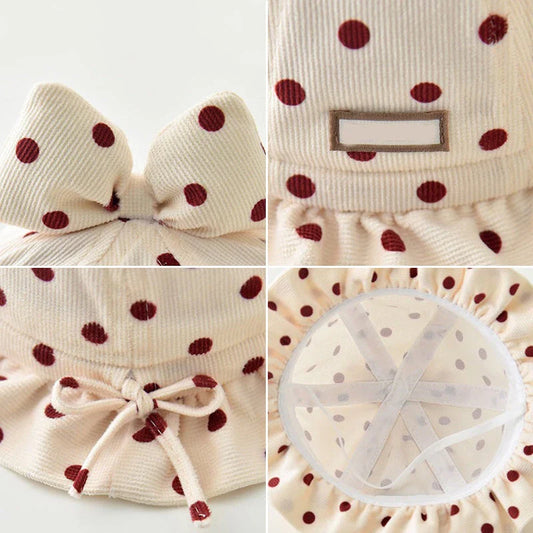 Stylish corduroy baby bucket hat with adorable dot pattern and bow detail, perfect for Kiwi kids