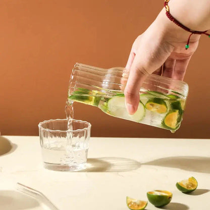 Glass water bottle and teacup set with elegant, transparent design for refreshing hydration