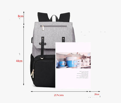 Versatile mum's backpack with pink color, featuring side pockets, zippered compartments, and stroller attachment hooks