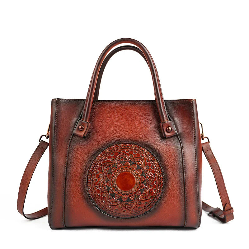 Stylish diagonal leather handbag in red, brown, and gray colours, featuring a roomy interior, multiple pockets, and a comfortable hard handle