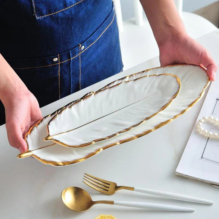 Elegant feather-shaped ceramic storage tray in white with hand-painted designs, perfect for serving, organizing, and decorating your Kiwi home