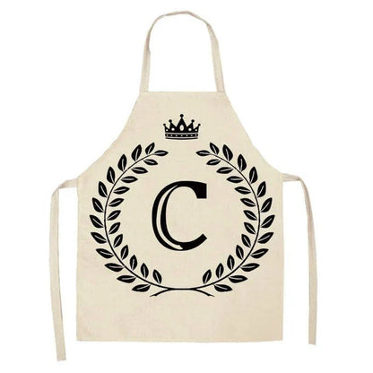 A crown and letter printed kitchen apron made of high-quality cotton and linen, suitable for both men and women in New Zealand kitchens.