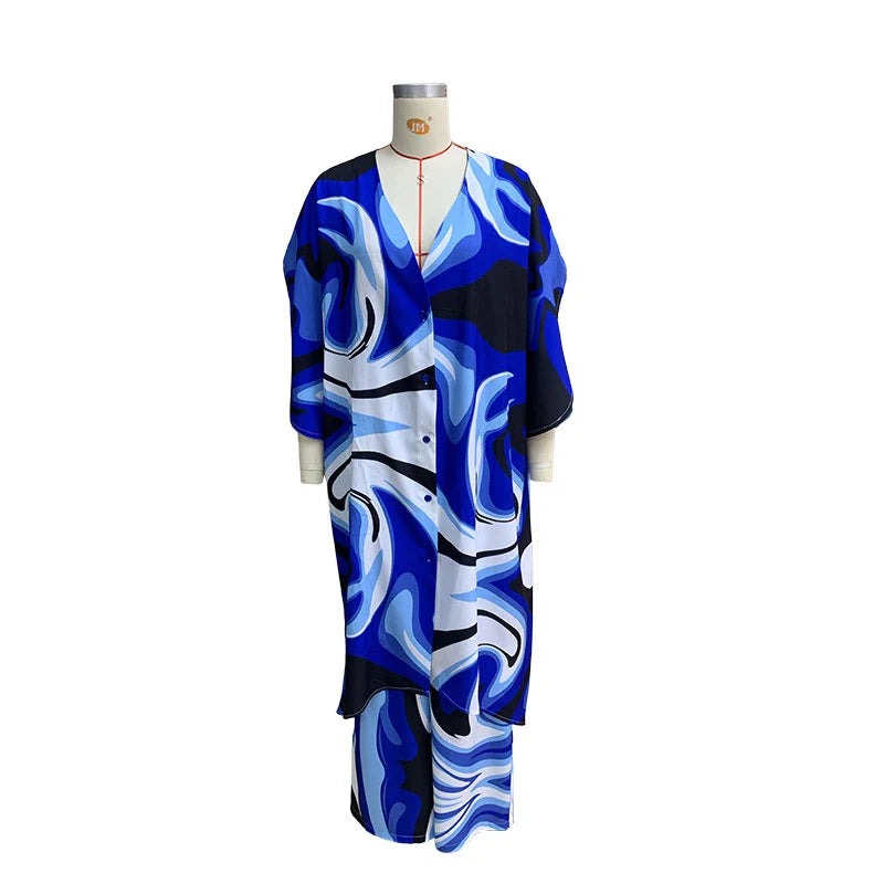 Stylish two-piece set with batwing sleeve top and wide-leg trousers in a vibrant tie-dye pattern