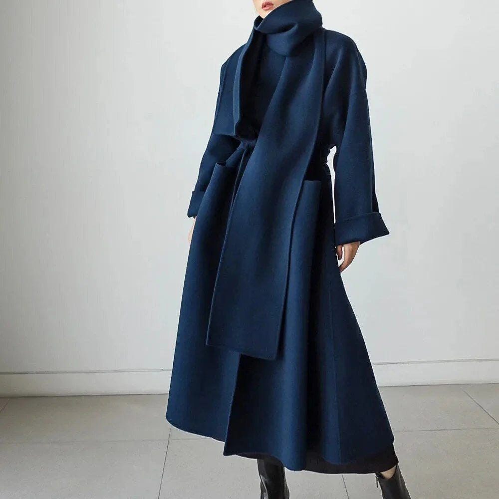 Stylish and warm New Zealand women's woollen coat in blue, featuring a chic scarf collar and relaxed fit design.