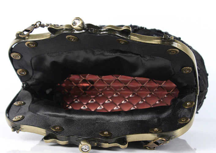 Bead embroidered fashion bag with silk surface, nylon exterior, and magnetic buckle closure