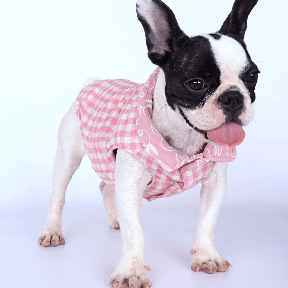 Stylish plaid pet vest for dogs in a variety of sizes, featuring a sleeveless design and durable polyester material.