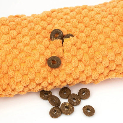 Soft, plush snail-shaped snuffle mat toy for dogs, with multiple treat-hiding pockets and a built-in sound generator for added engagement and mental stimulation.