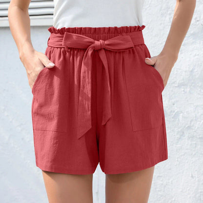 Stylish high-waisted ruffle bow shorts in black, perfect for Kiwi summer beach and casual wear