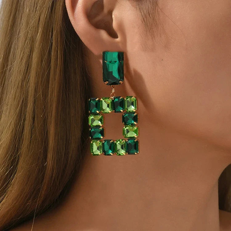 Stunning transparent crystal earrings in a variety of colours, including rose red, green, pink, champagne, white, and black.