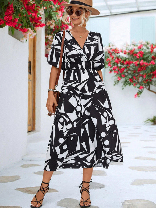 A stylish puff-sleeve dress with a printed surplice neckline, perfect for casual and dressy occasions.