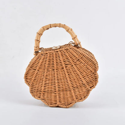 Rattan straw bag with intricate three-dimensional conch shell design, ideal for everyday use and a touch of coastal chic