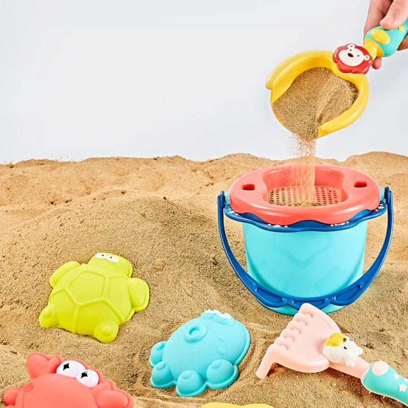 Colorful beach toy set with shovels, sand molds, and a convenient carry bag for outdoor fun