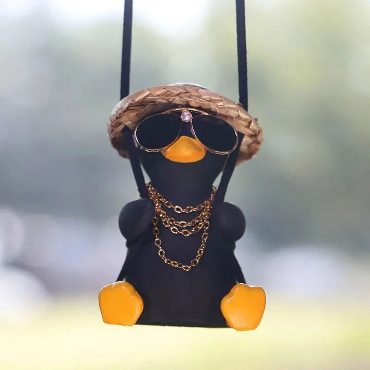 A charming swinging duck car pendant with a guitar and coke-themed design, adding a touch of Kiwi personality to your vehicle.