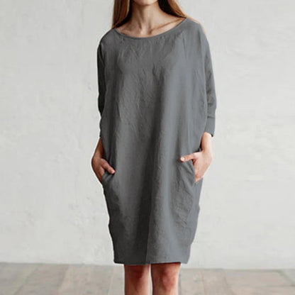 A cotton and linen dress with a round neckline, pockets, and an A-line silhouette in various colors.