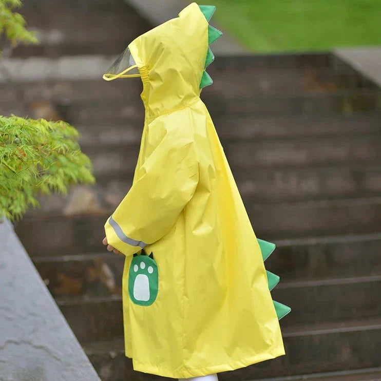 A child wearing a vibrant yellow waterproof raincoat jumpsuit, perfect for playing outdoors in the rain.