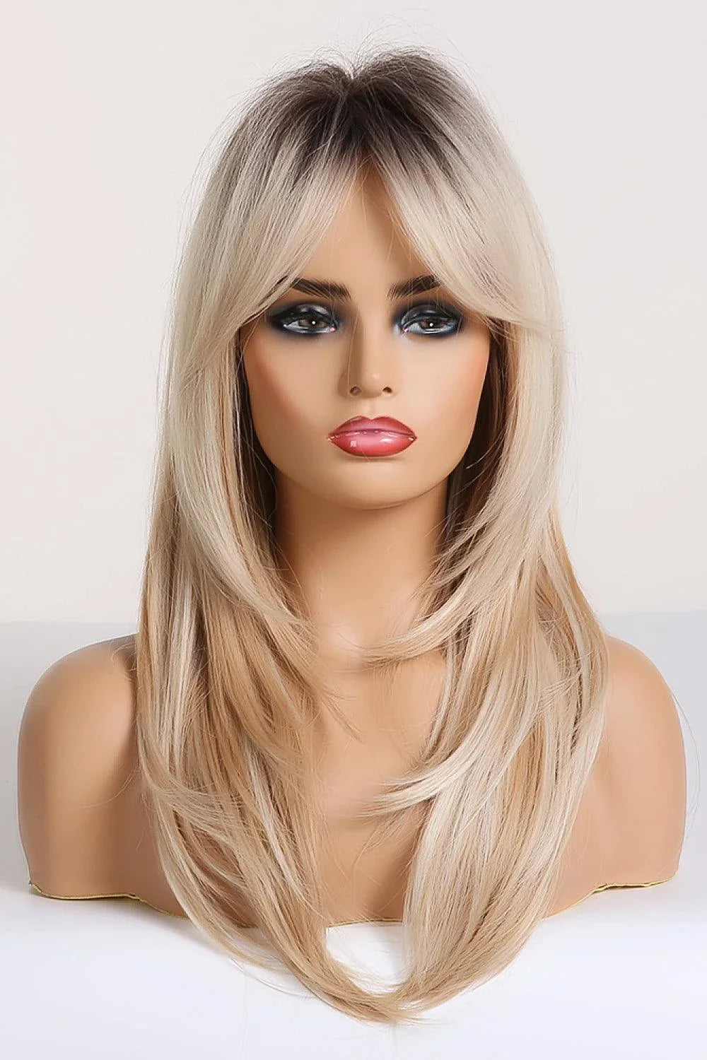 Stylish mid-length wave synthetic wig in cream color with comfortable cap construction and heat-safe synthetic fibres