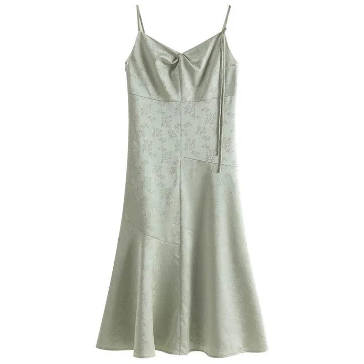 Elegant and stylish mint green midi dress with spaghetti straps, perfect for summer events and occasions.