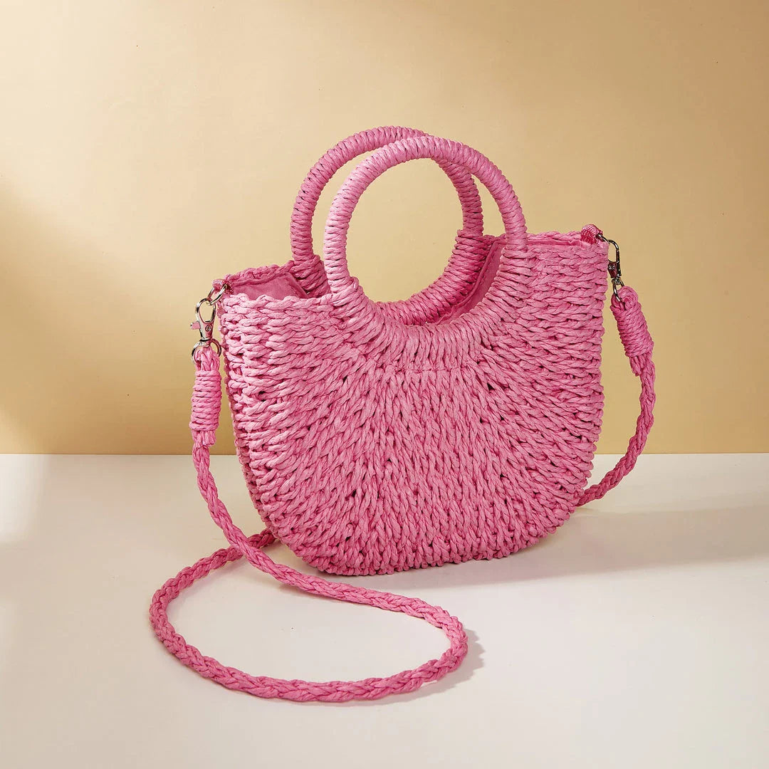 Stylish and eco-friendly straw woven beach bag for Kiwi women, featuring a unique half-moon shape, premium paper straw, and cotton lining.