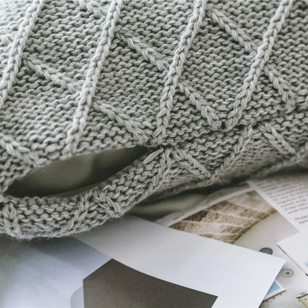 Elegant grey knitted decorative pillow case with intricate jacquard pattern and embroidered stripes