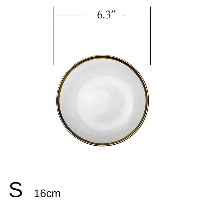 Elegant glass plates with a shimmering gold rim, perfect for formal dinners or casual meals.