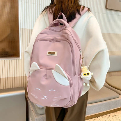 A stylish Japanese-inspired cat backpack with a large capacity, breathable nylon construction, and dedicated storage compartments for student essentials.